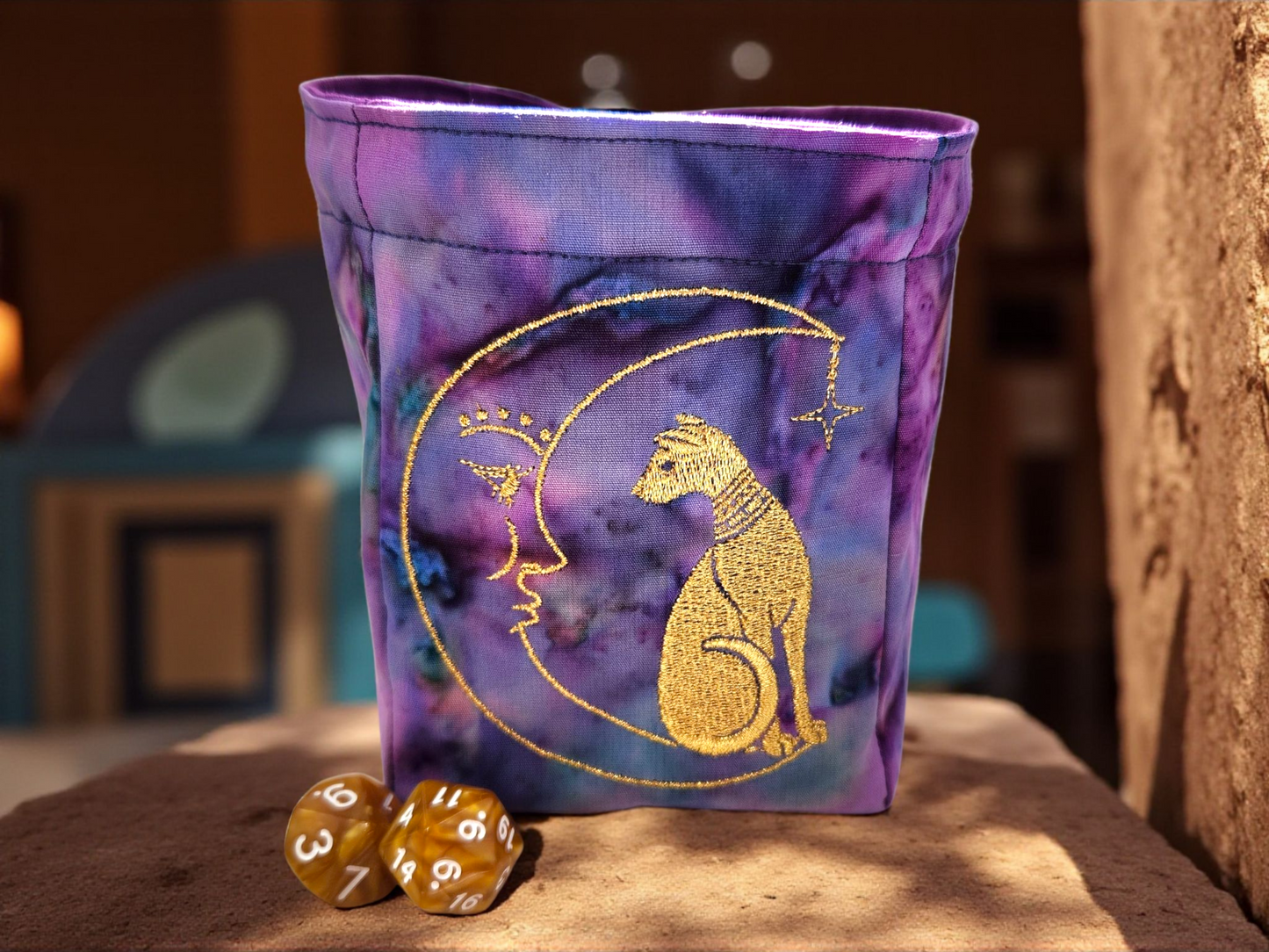 Sleek can and moon dice bag.