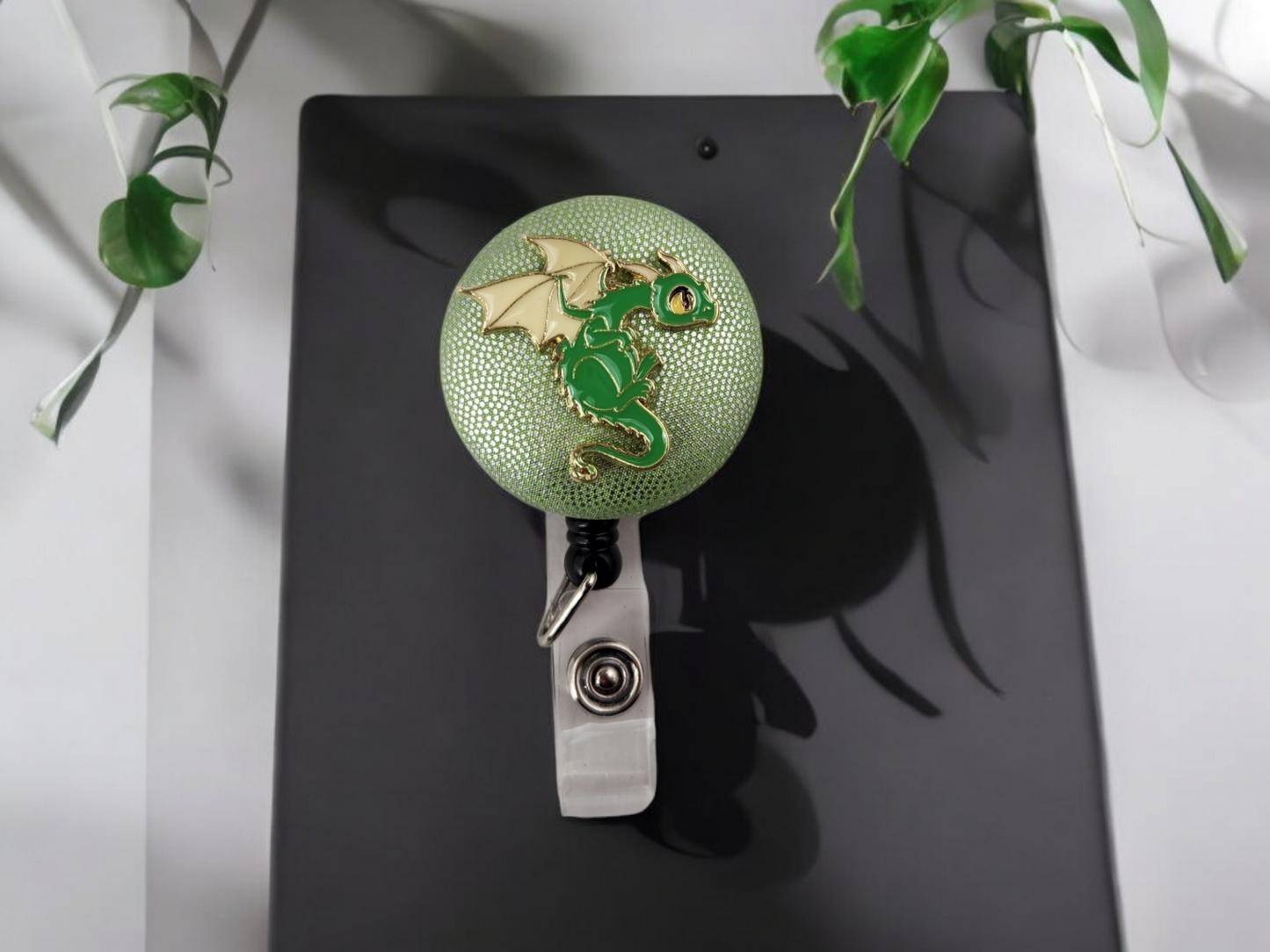 badge reel, green and gold dragon