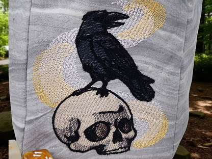 Raven, skull and magic dice bag