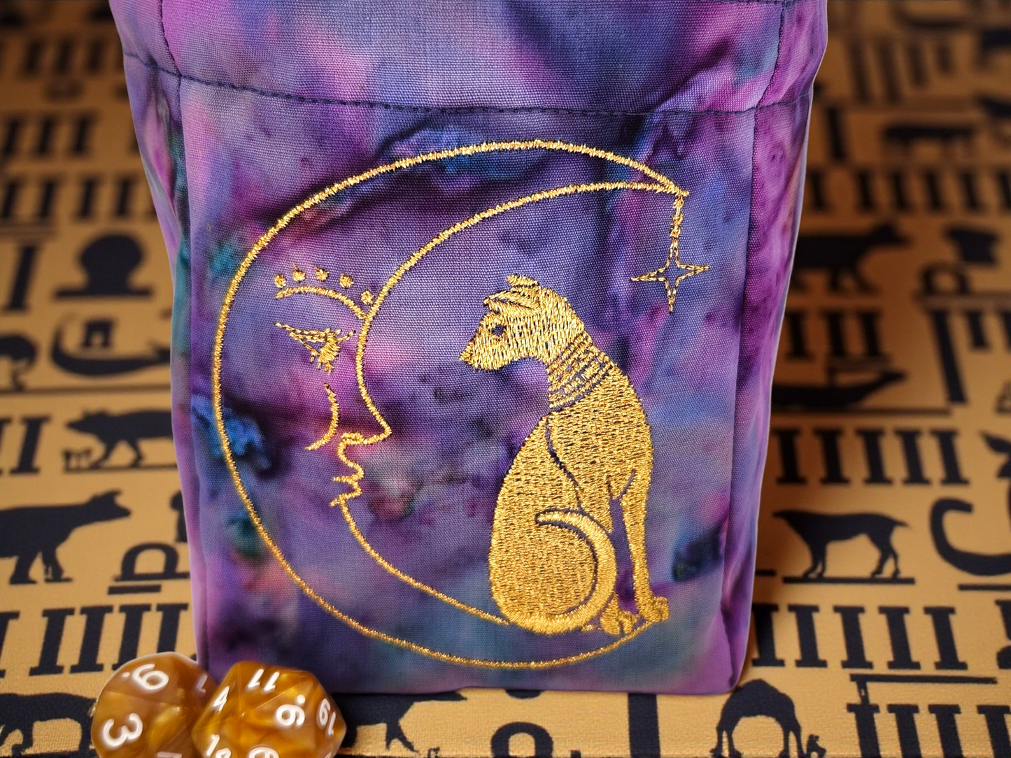 Sleek can and moon dice bag.