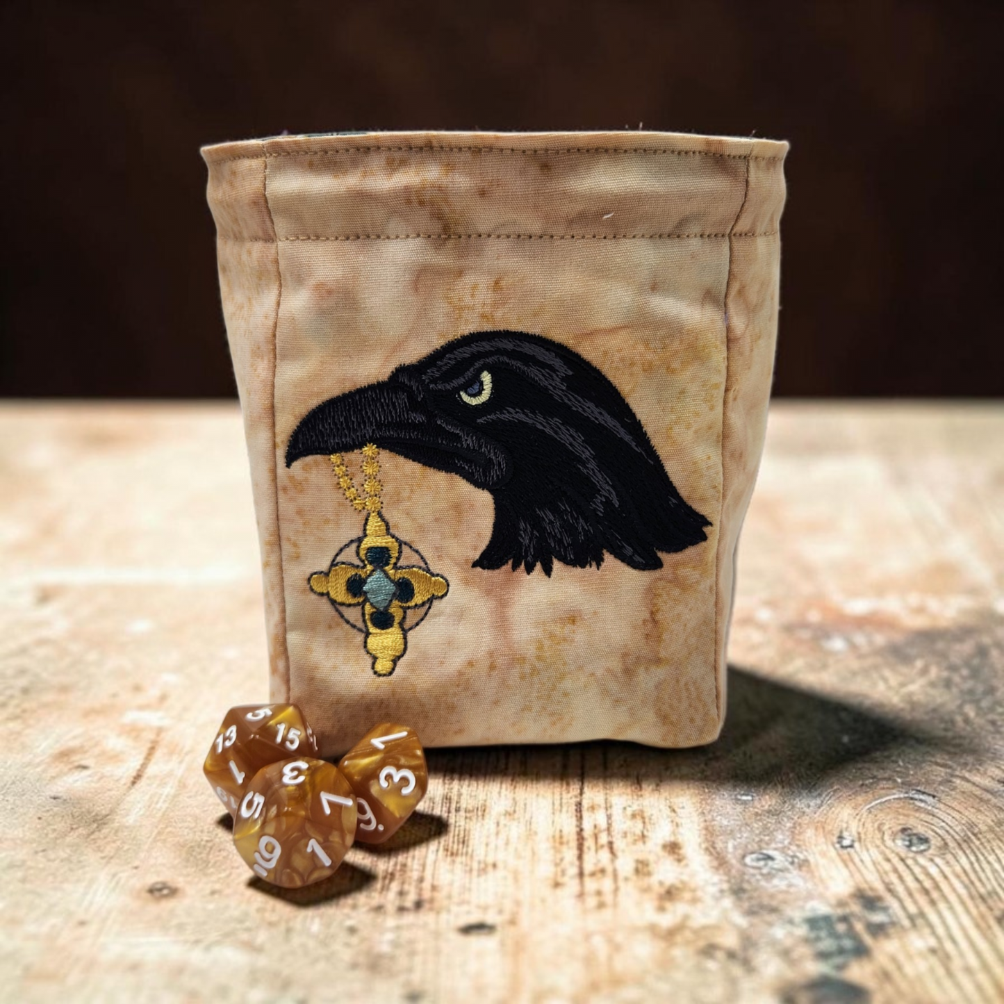 Raven with shiny treasure dice bag