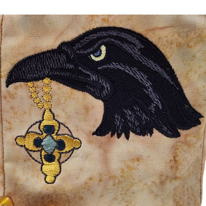 Raven with shiny treasure dice bag