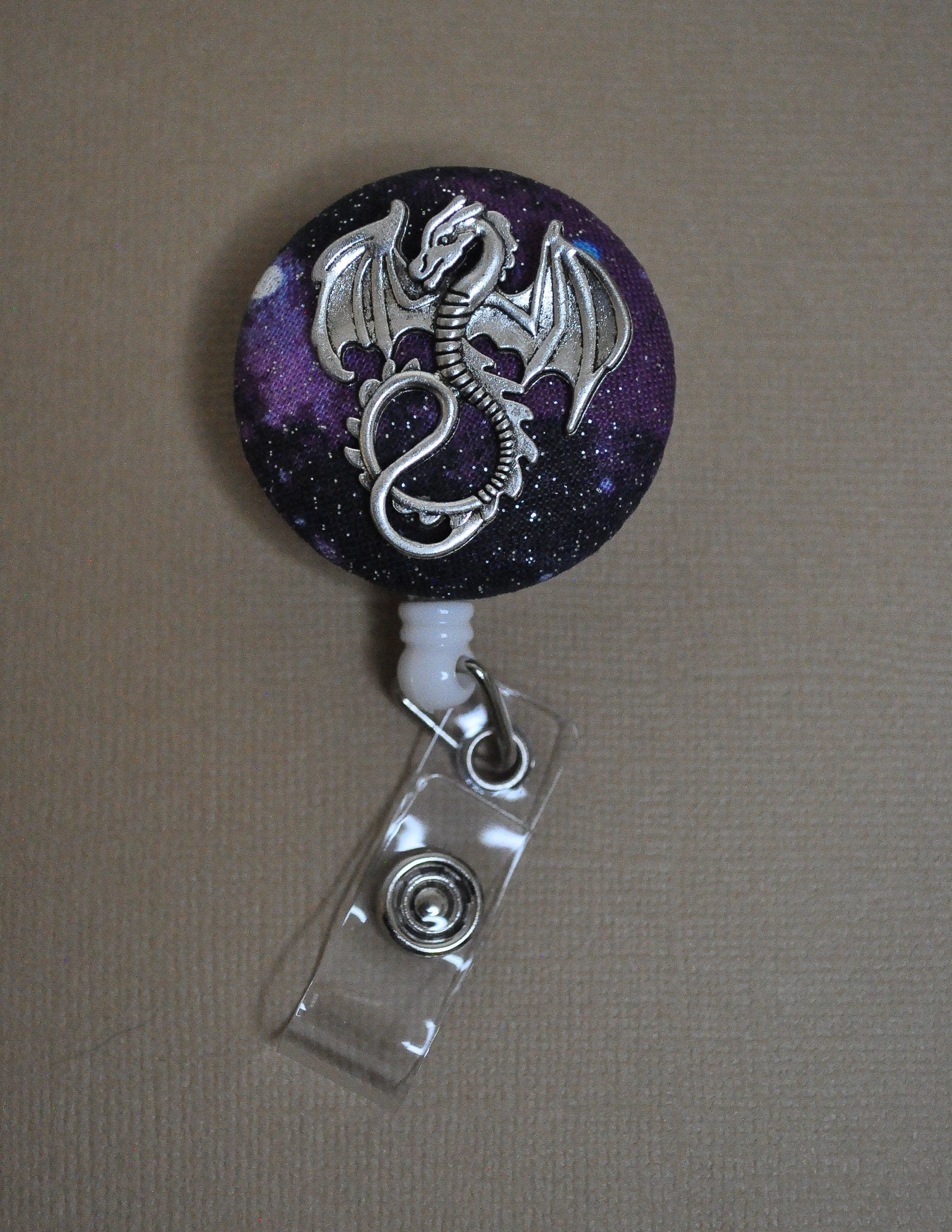 Badge reel, silver dragon on nebula fabric - Rowan Gate