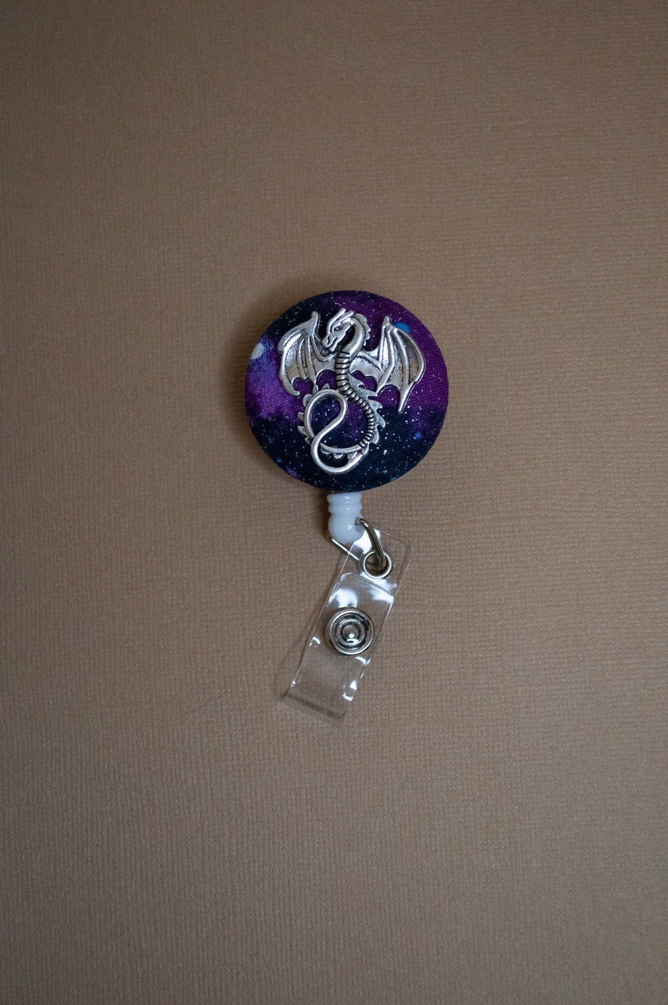 Badge reel, silver dragon on nebula fabric - Rowan Gate