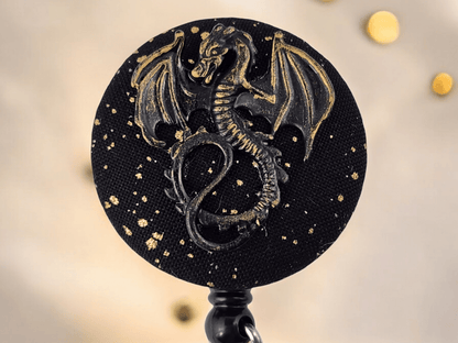 Black and gold dragon badge reel - Rowan Gate